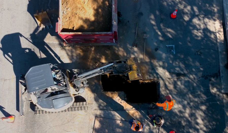 Underground repair of a burst water pipe using trenchless equipment